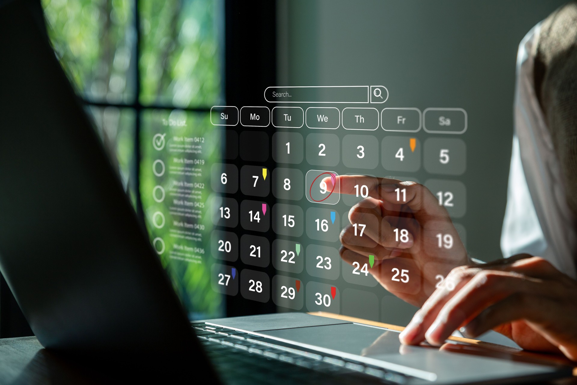 Businessman using laptop to highlight appointment reminders .